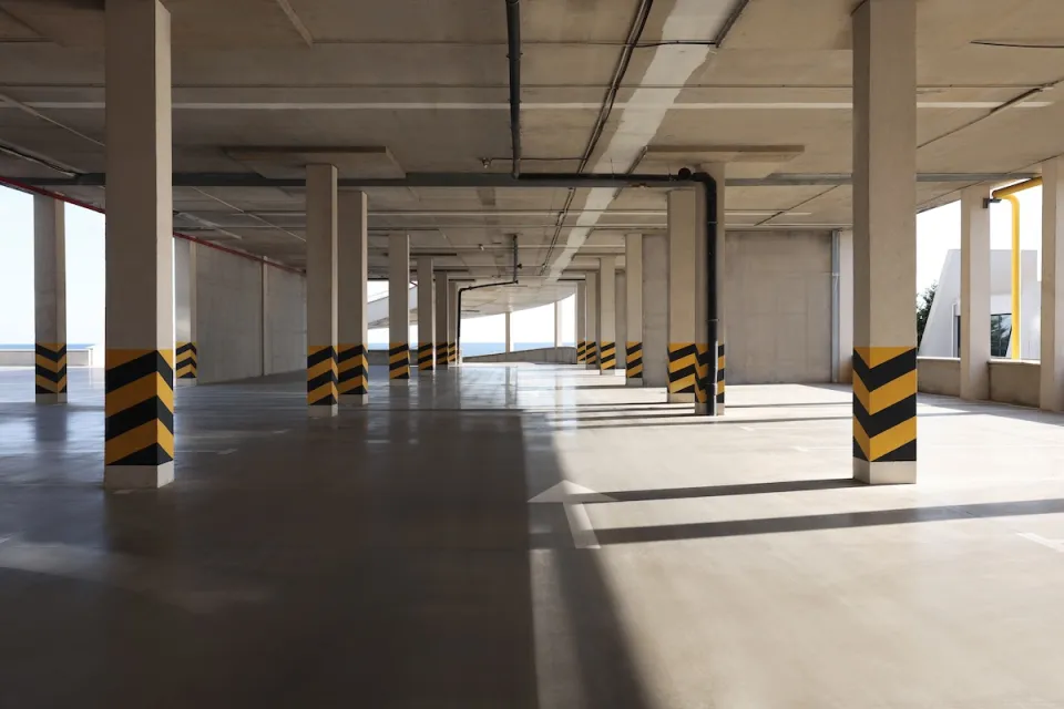 Empty elevated parking garage with sunlight coming in.